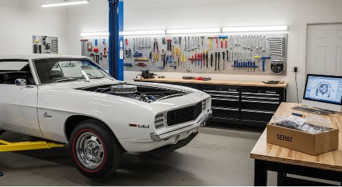 A classic car under restoration in a garage, showing the need for spare parts coverage.