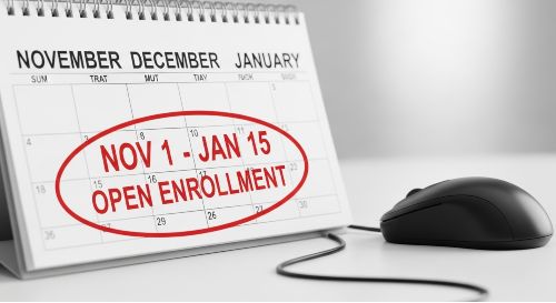 A calendar page with "Open Enrollment" marked with a red circle, symbolizing the specific time window to sign up for a plan.