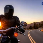 Rider on a scenic road considering Geico motorcycle insurance.